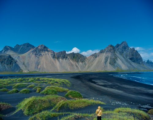 Free Majestic Vestrahorn mountain and black sand beach under a clear blue sky in Iceland. Stock Photo