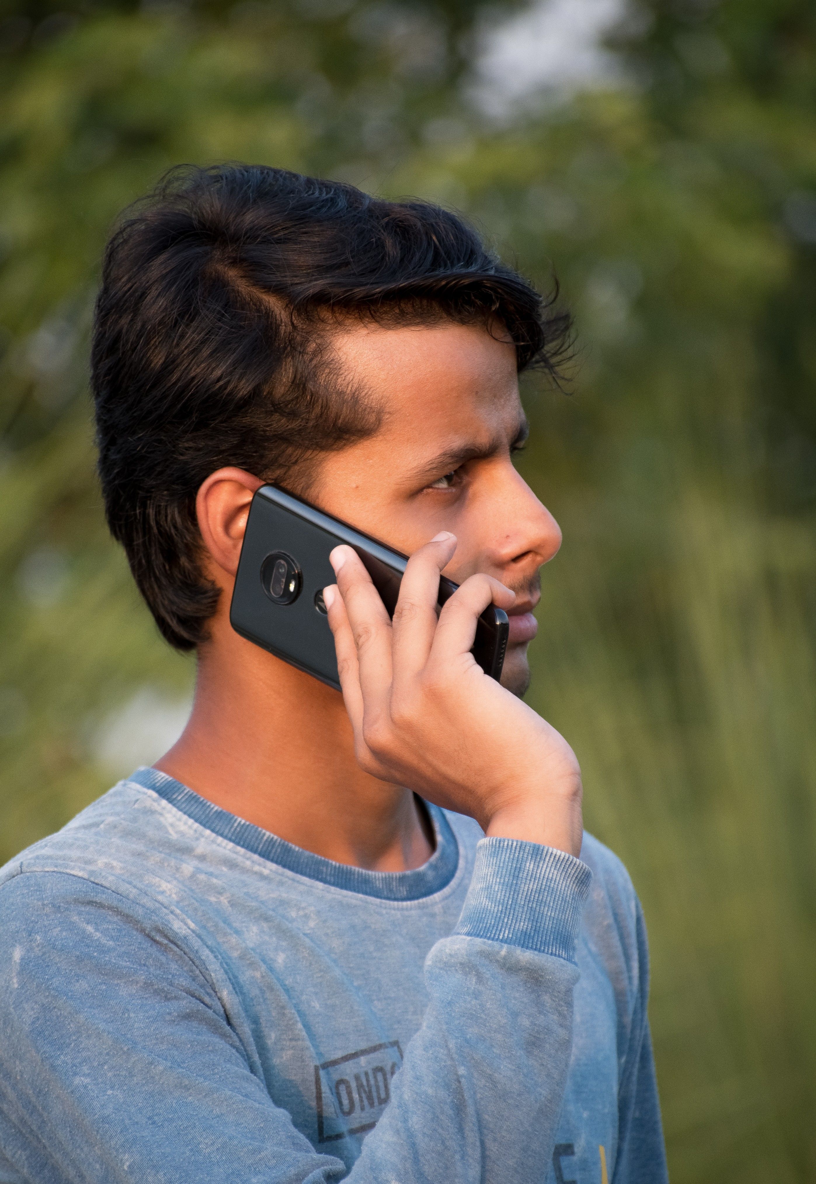 A man talking on a cell phone · Free Stock Photo
