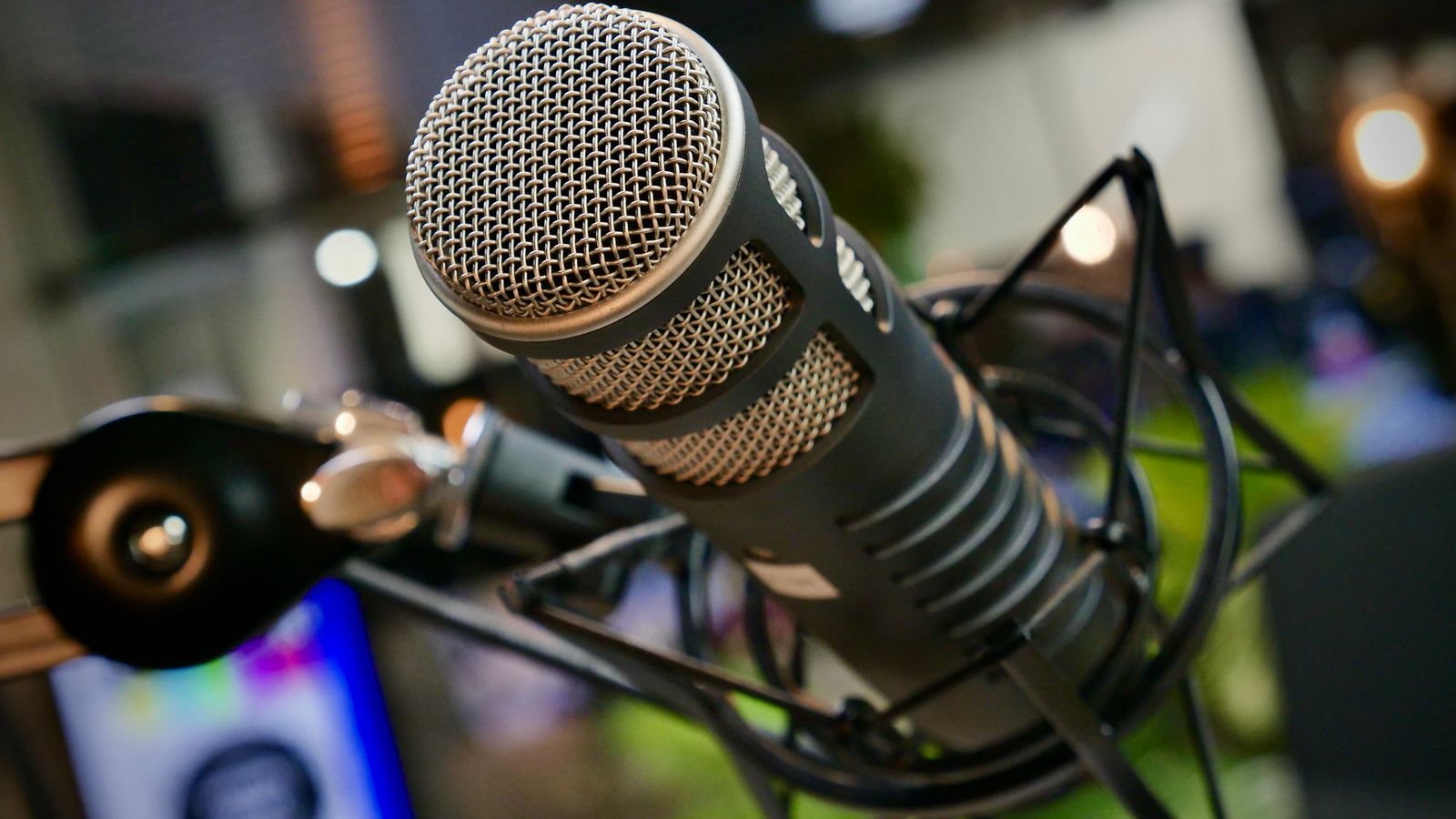 Close-up of a studio microphone on a stand with no people in the frame, a real stock photo that echoes Ali G's trademark: the interview microphone he shoves in front of unsuspecting guests