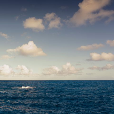 Open ocean under low scattered clouds — christian buehner on Pexels