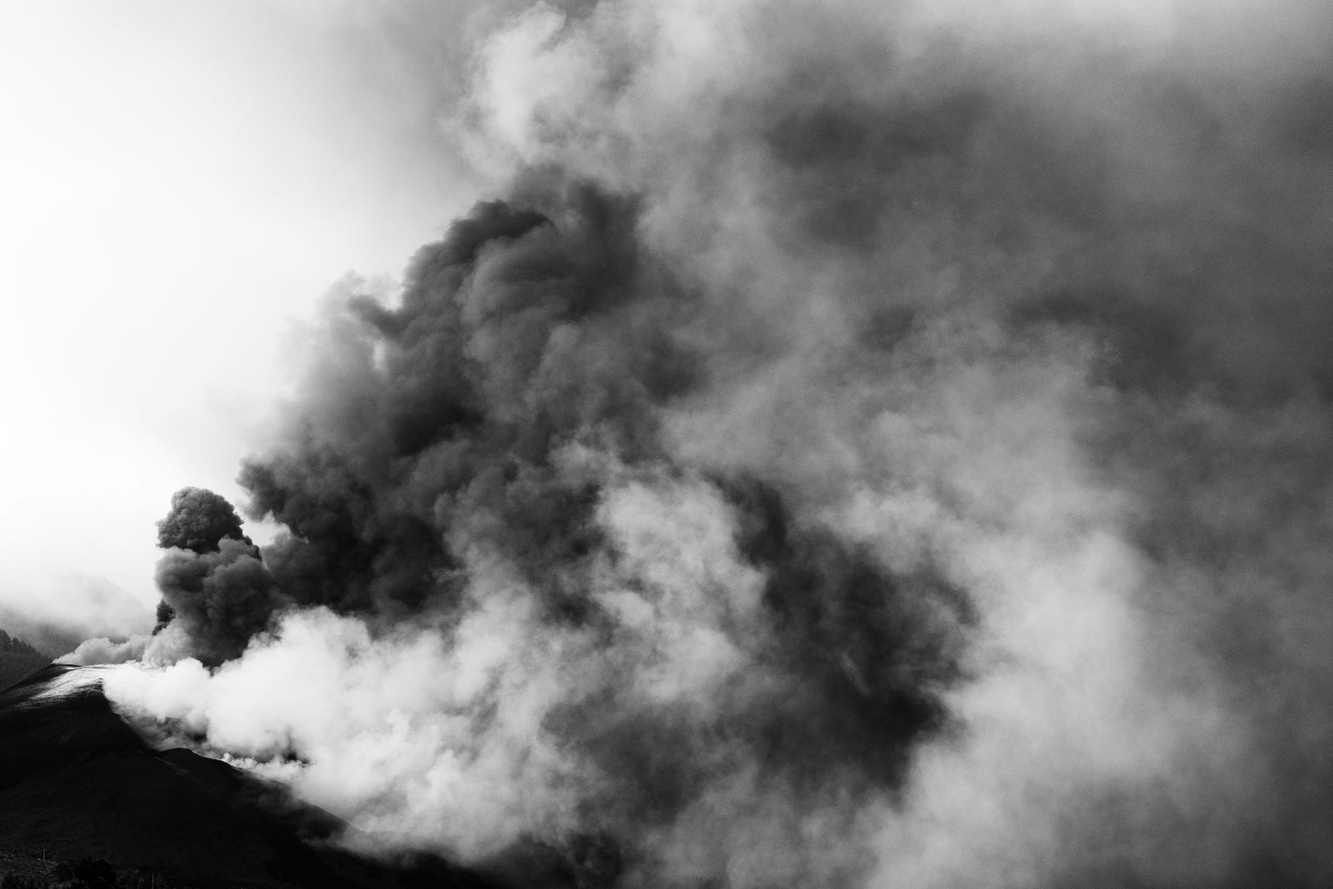 Black and white image of a volcanic eruption representing indoor air pollution and VOCs in the home.