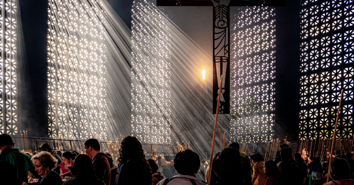 Modern church architecture in Ho Ghana with worshippers walking in at sunset
