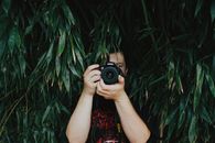 Person Holding Dslr Camera