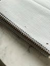 A notebook with a spiral bound notebook on top of a marble table