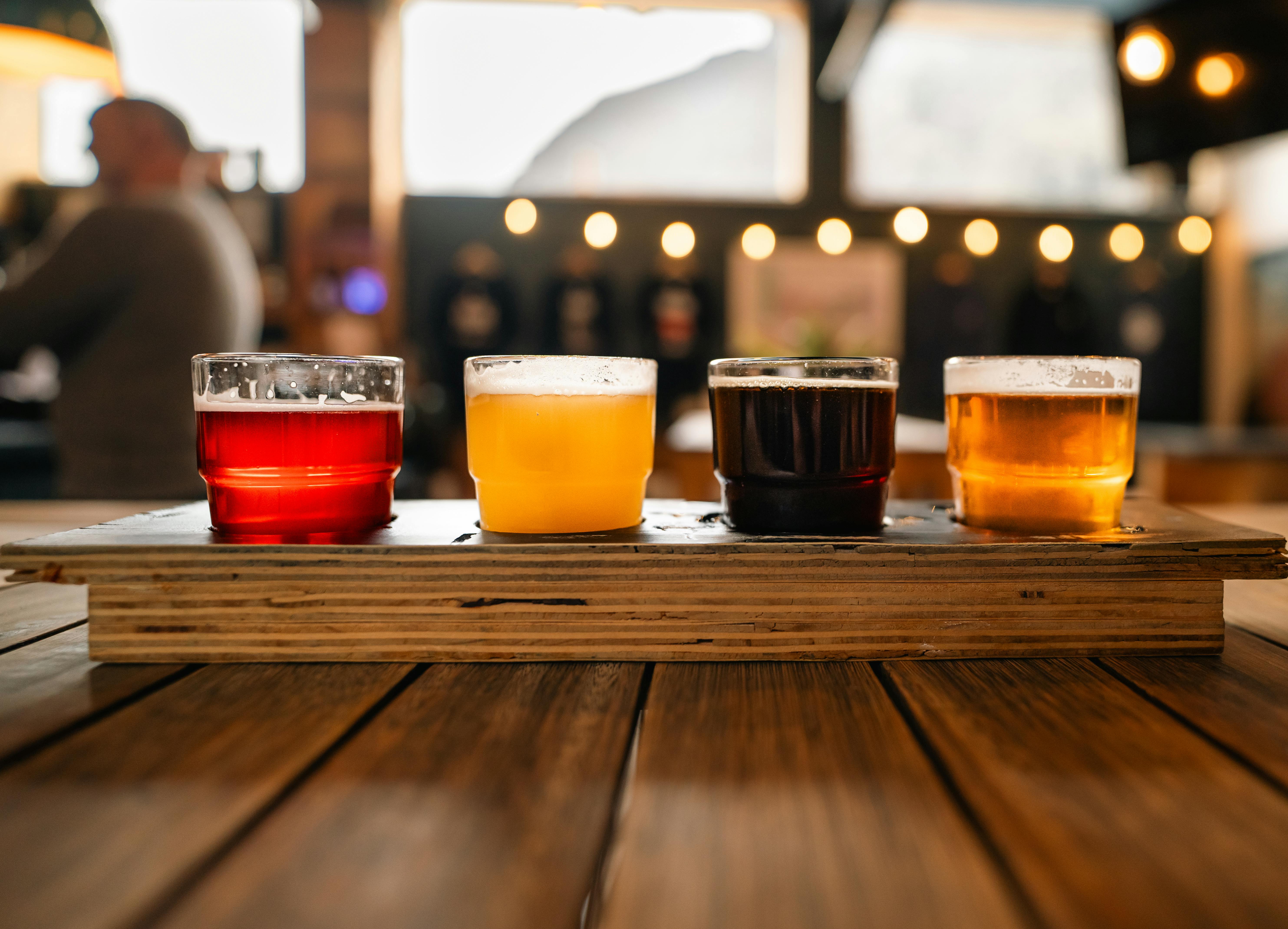 a tray of beer on a wooden table