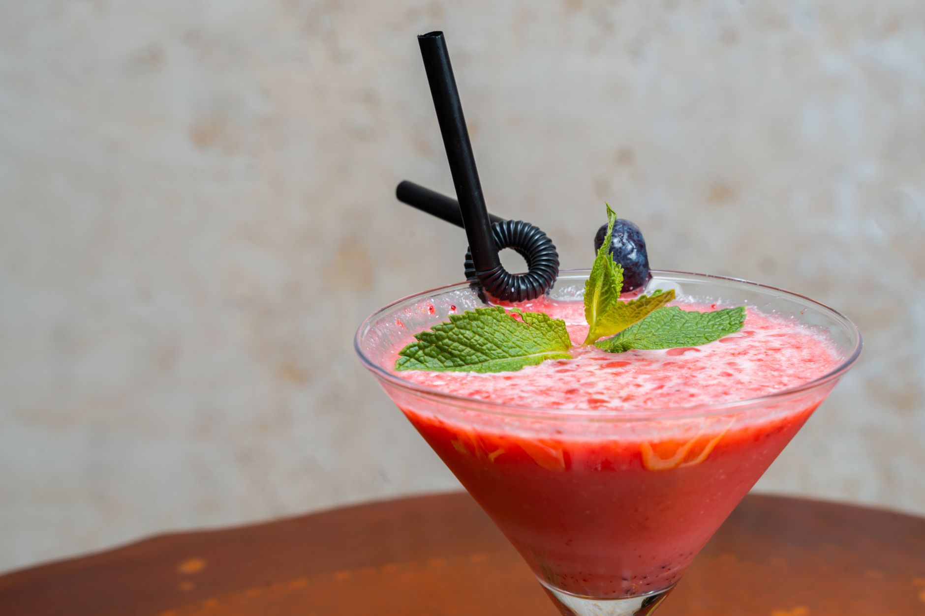 iced shake method long covid brain fog recovery — A delightful fruity cocktail garnished with mint and berries in a martini glass.
