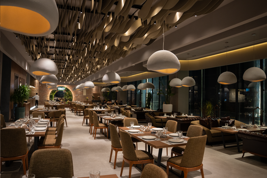 Stylish restaurant with modern decor, ambient lighting, and elegant seating in Sulaymaniyah, Kurdistan.