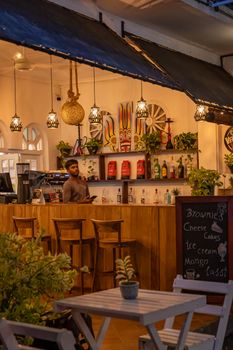 A charming bar setting in Galle, Sri Lanka with tropical decor and warm lighting.