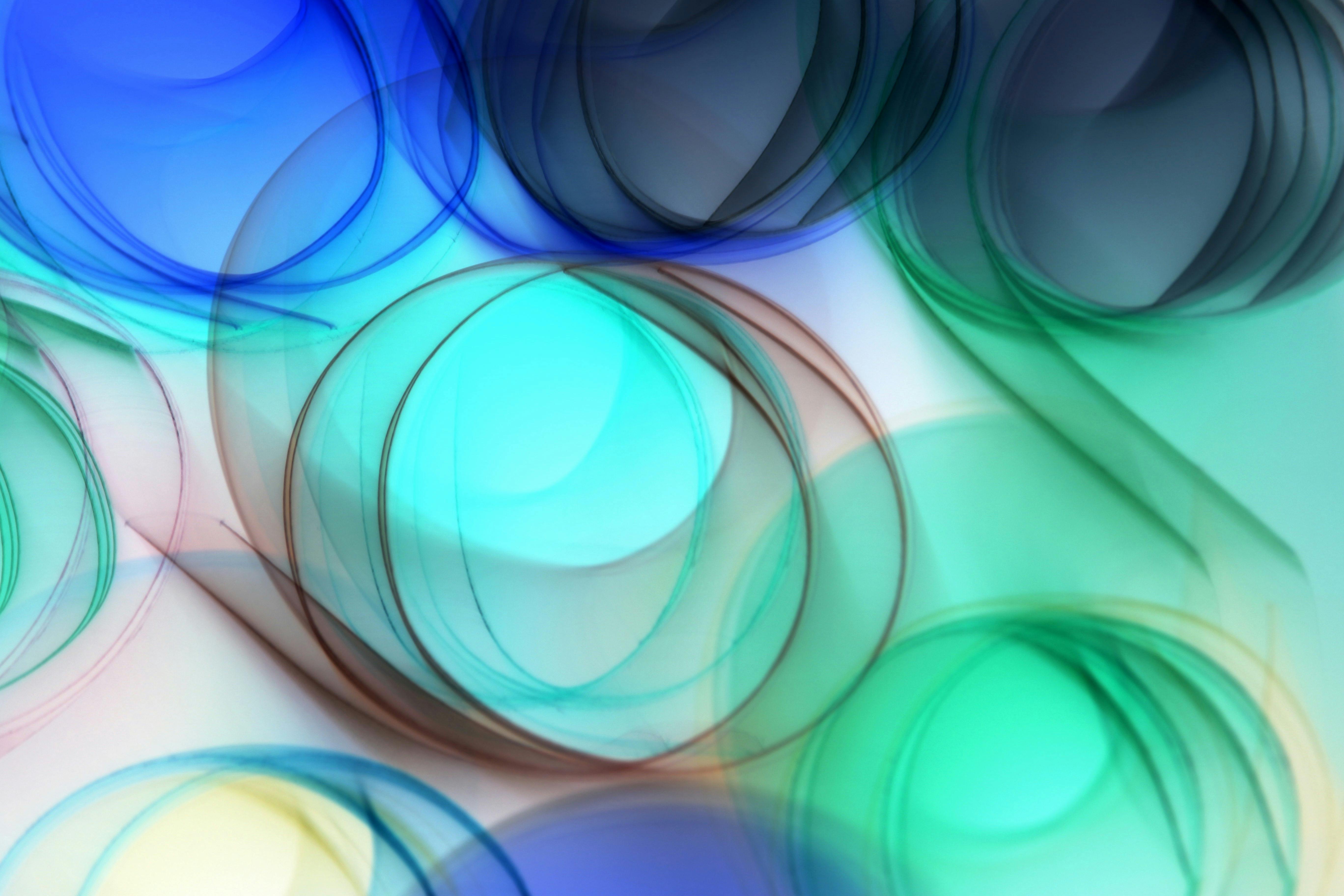 A vivid abstract swirl pattern in blues and greens, perfect for creative backgrounds or design elements.