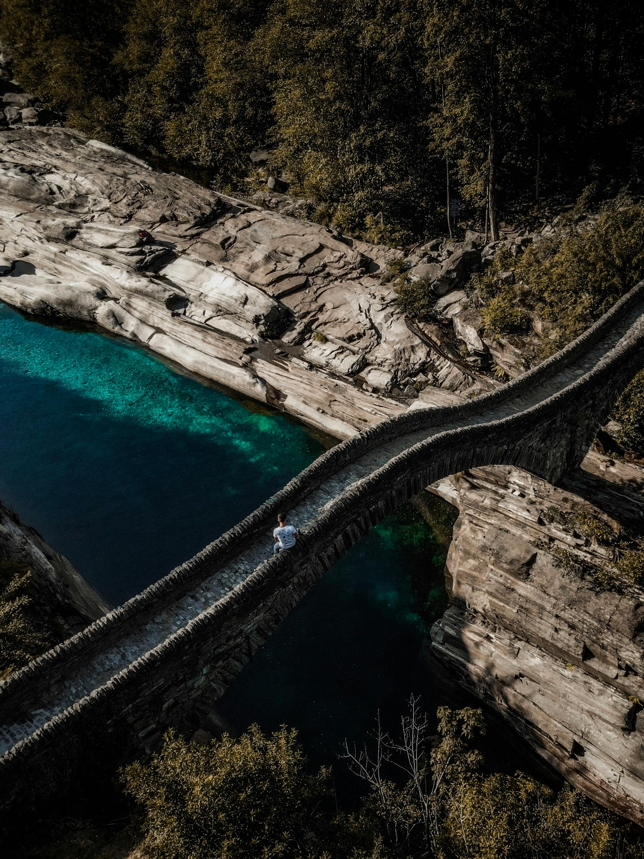 A scenic view of Ponte dei Salti in Lavertezzo, Switzerland, over turquoise waters.