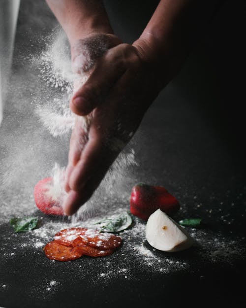 Person Pouring Flour