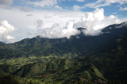 Free Breathtaking mountain landscape in Lào Cai, Vietnam with lush greenery and clouds. Stock Photo