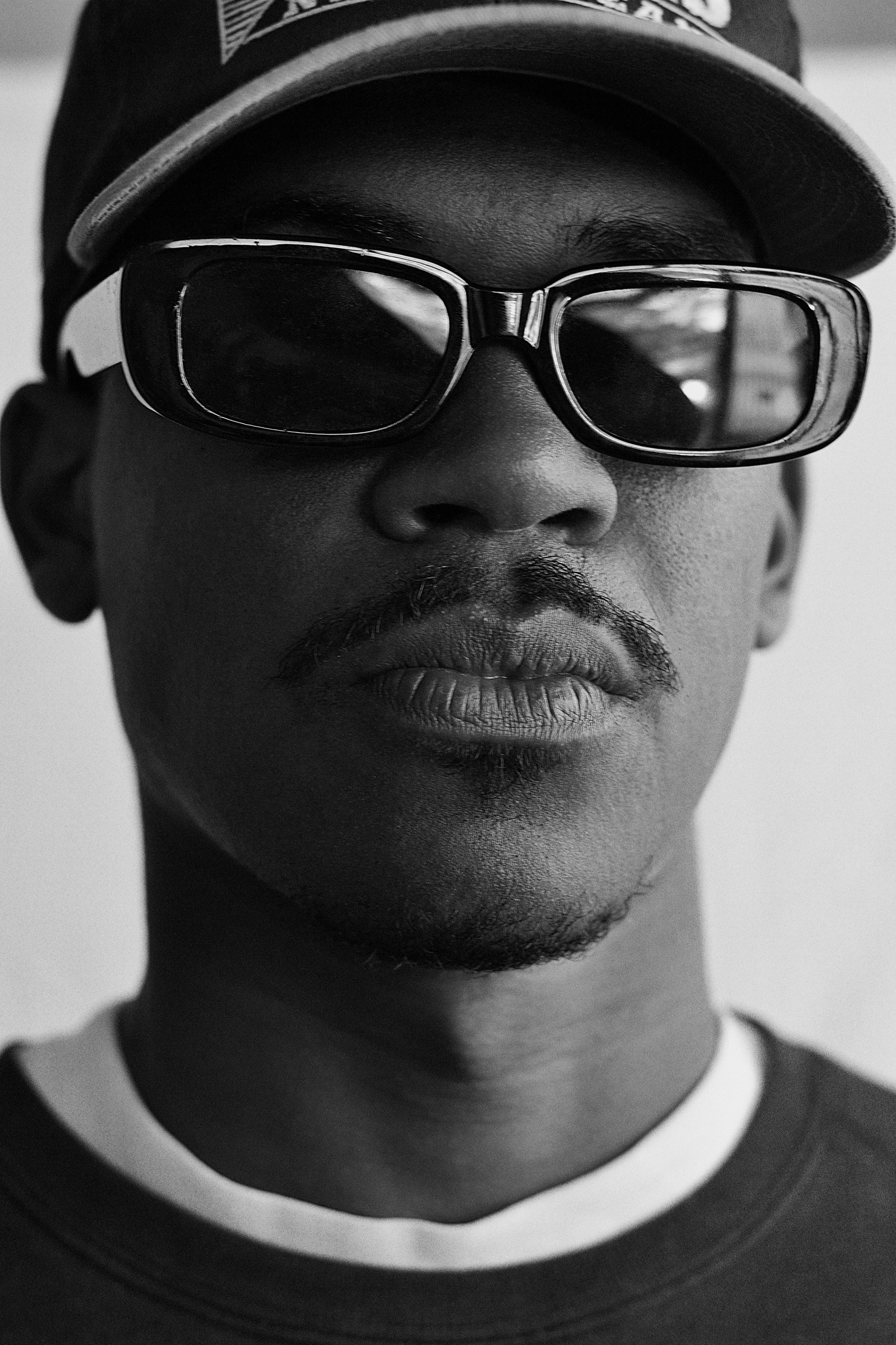 A black and white photo of a man wearing sunglasses · Free Stock Photo