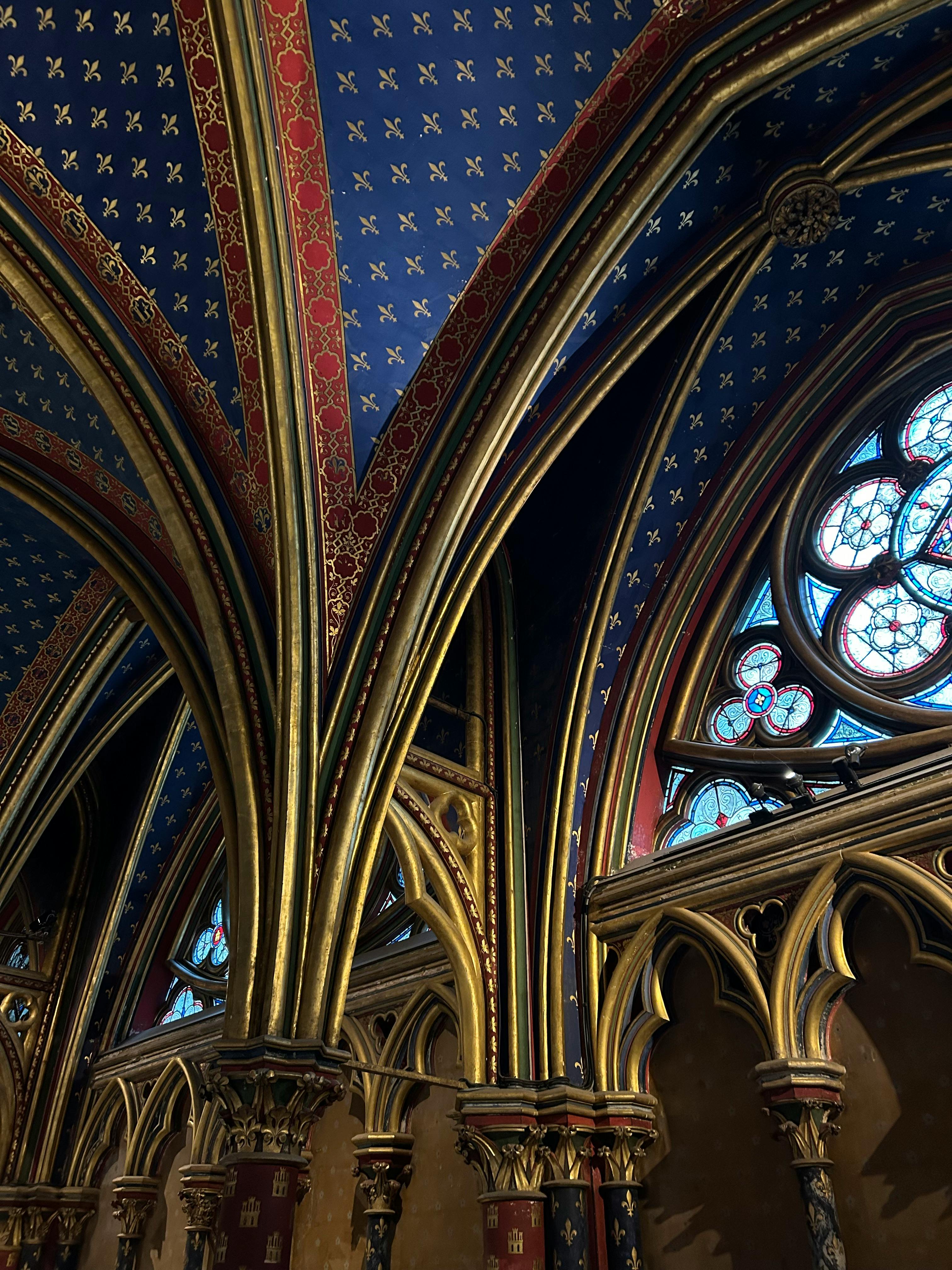 interior of the chapel with richly decorated arches and stained glass window