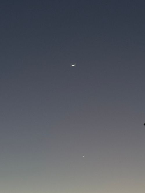 Free A crescent moon and evening star visible in the twilight sky near Aeroclube, Brazil. Stock Photo