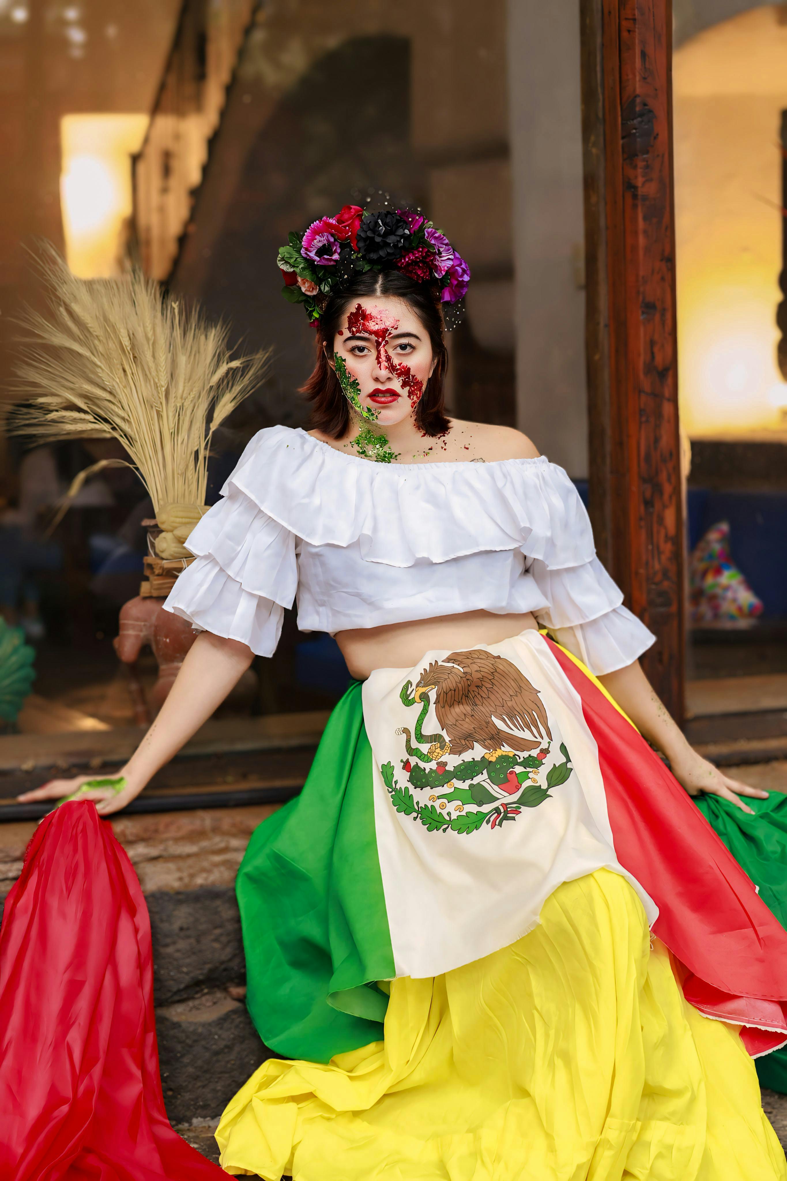 woman in blouse skirt and with flag of mexico