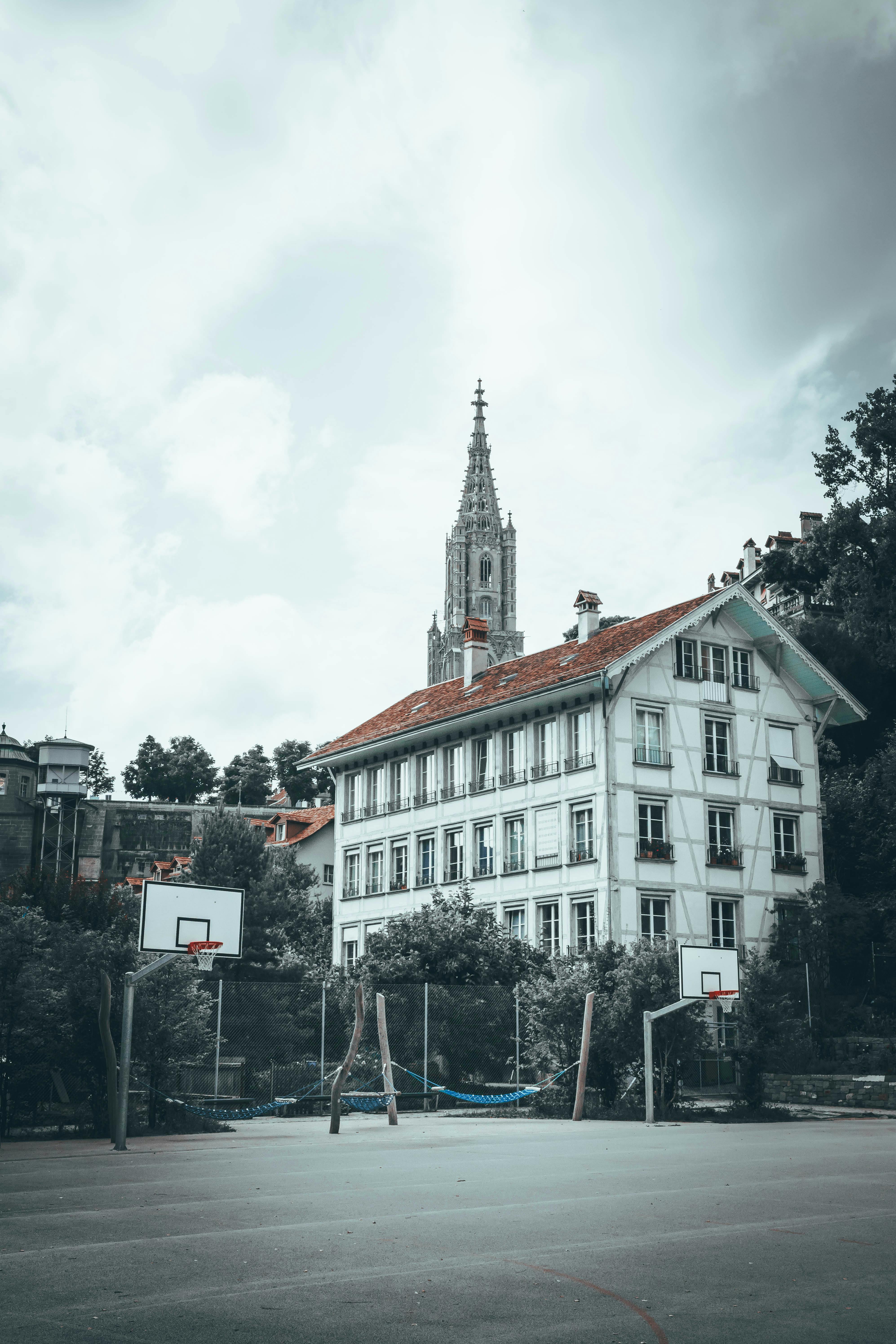 a basketball court in front of a church