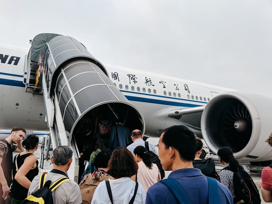 Traveler with luggage boarding high-speed train in China