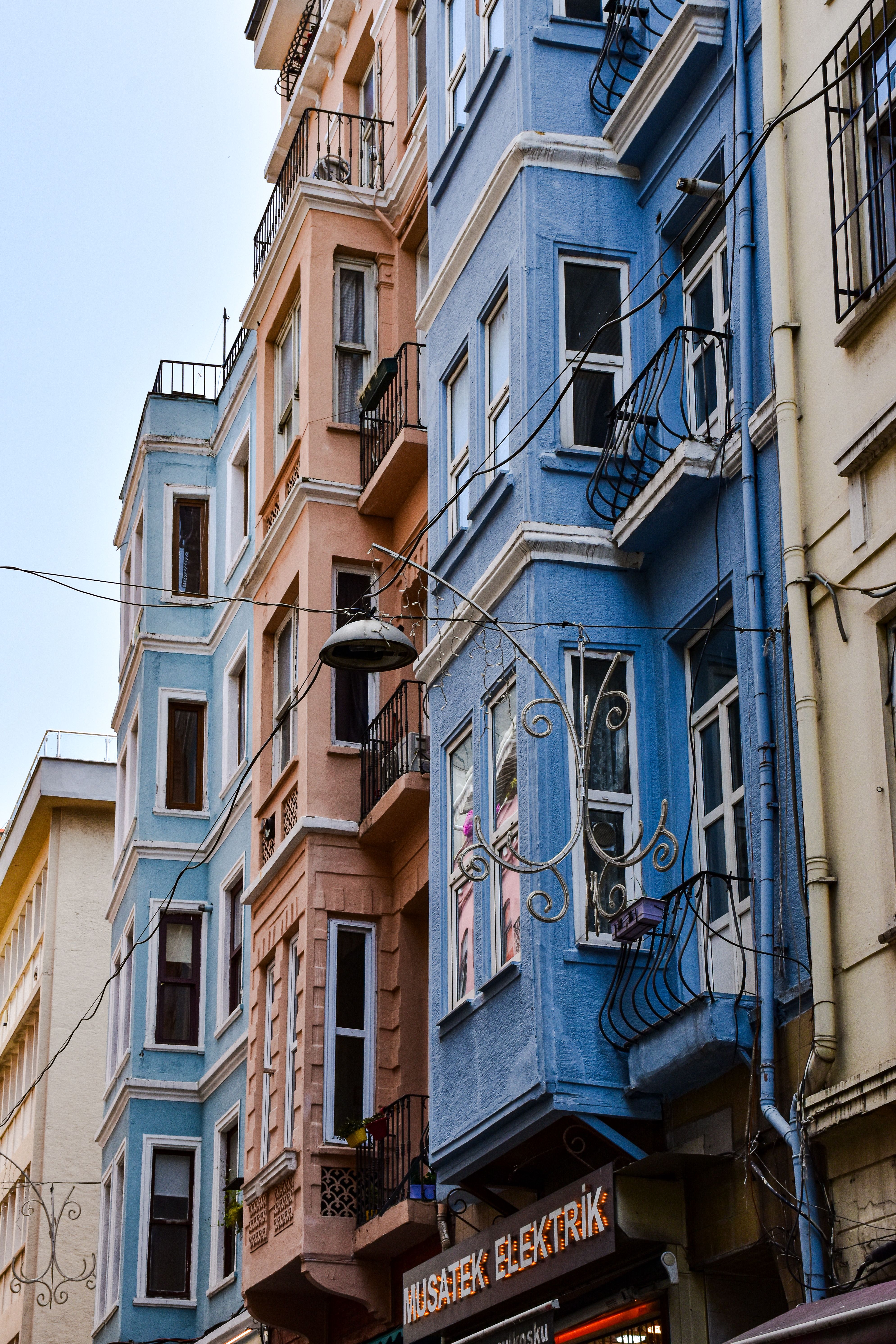 A street with many colorful buildings and balconies · Free Stock Photo