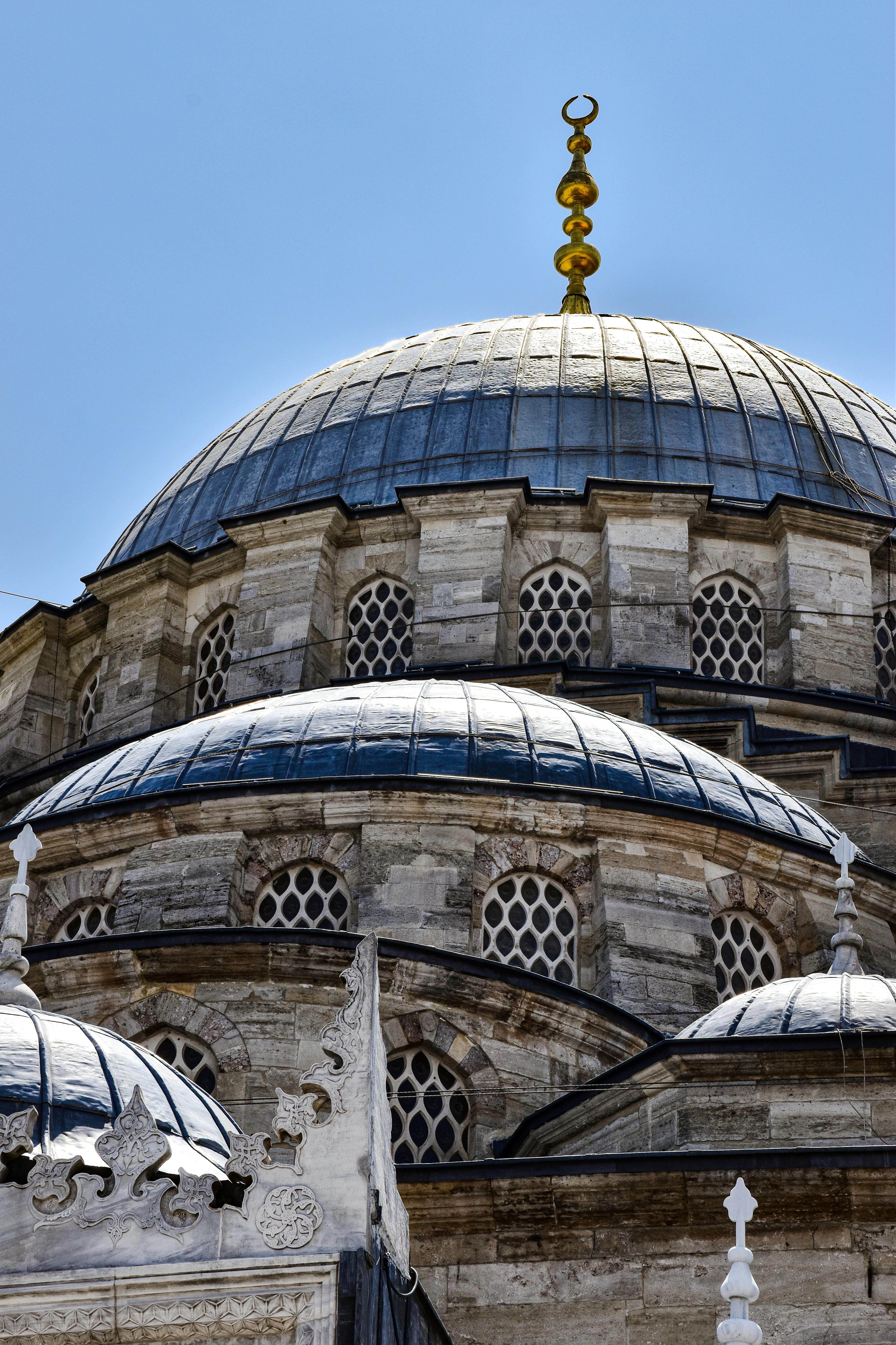 the dome of a mosque is seen in the background