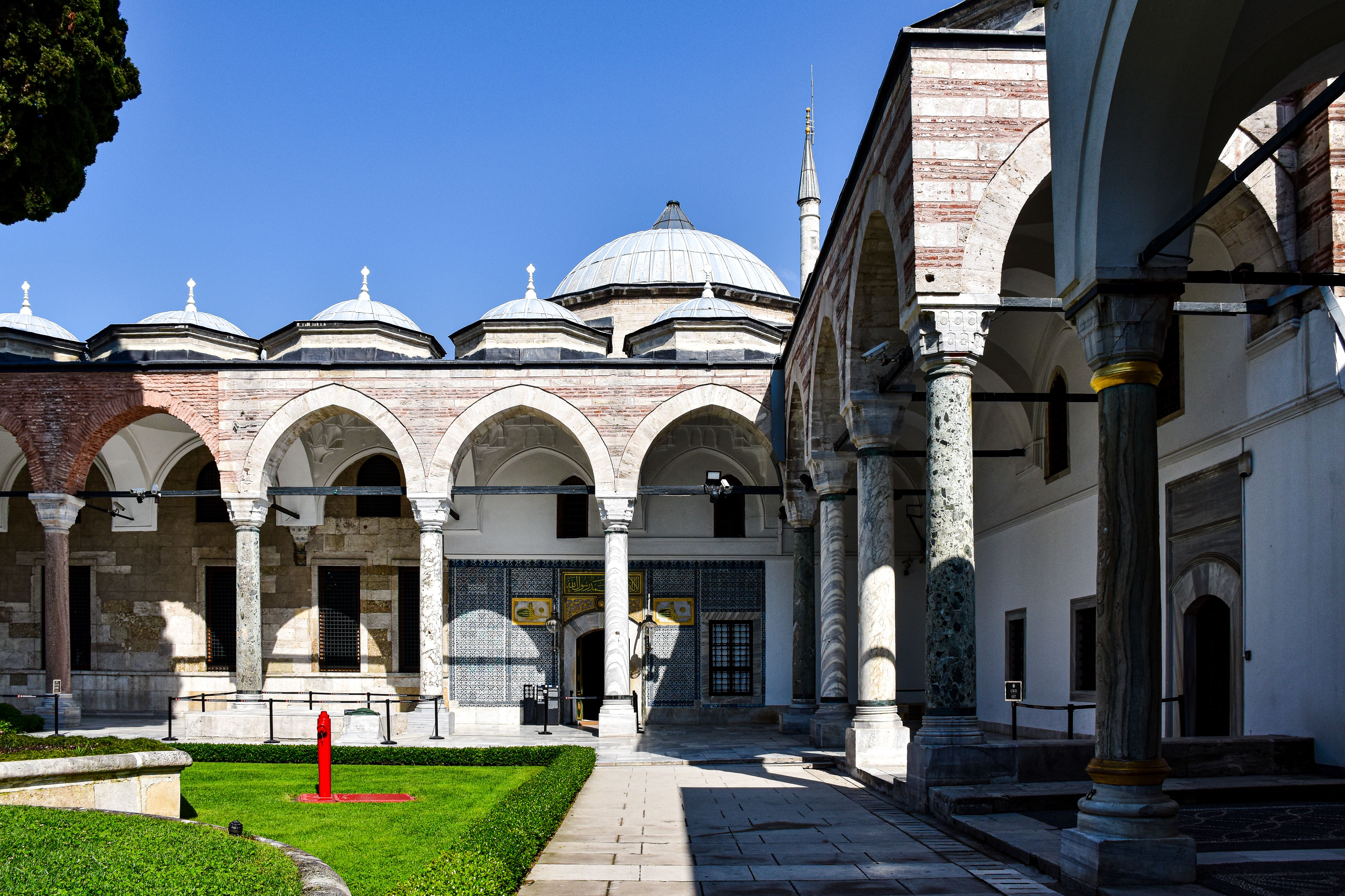 Beautiful Ottoman architecture in an Istanbul courtyard with arches.