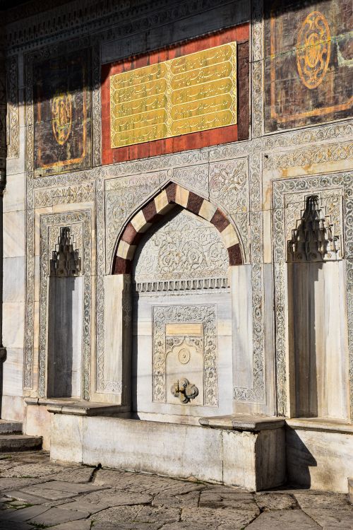 Free Explore the ornate stone and marble artwork on an Ottoman-era wall in Istanbul, Turkey, showcasing rich cultural history. Stock Photo