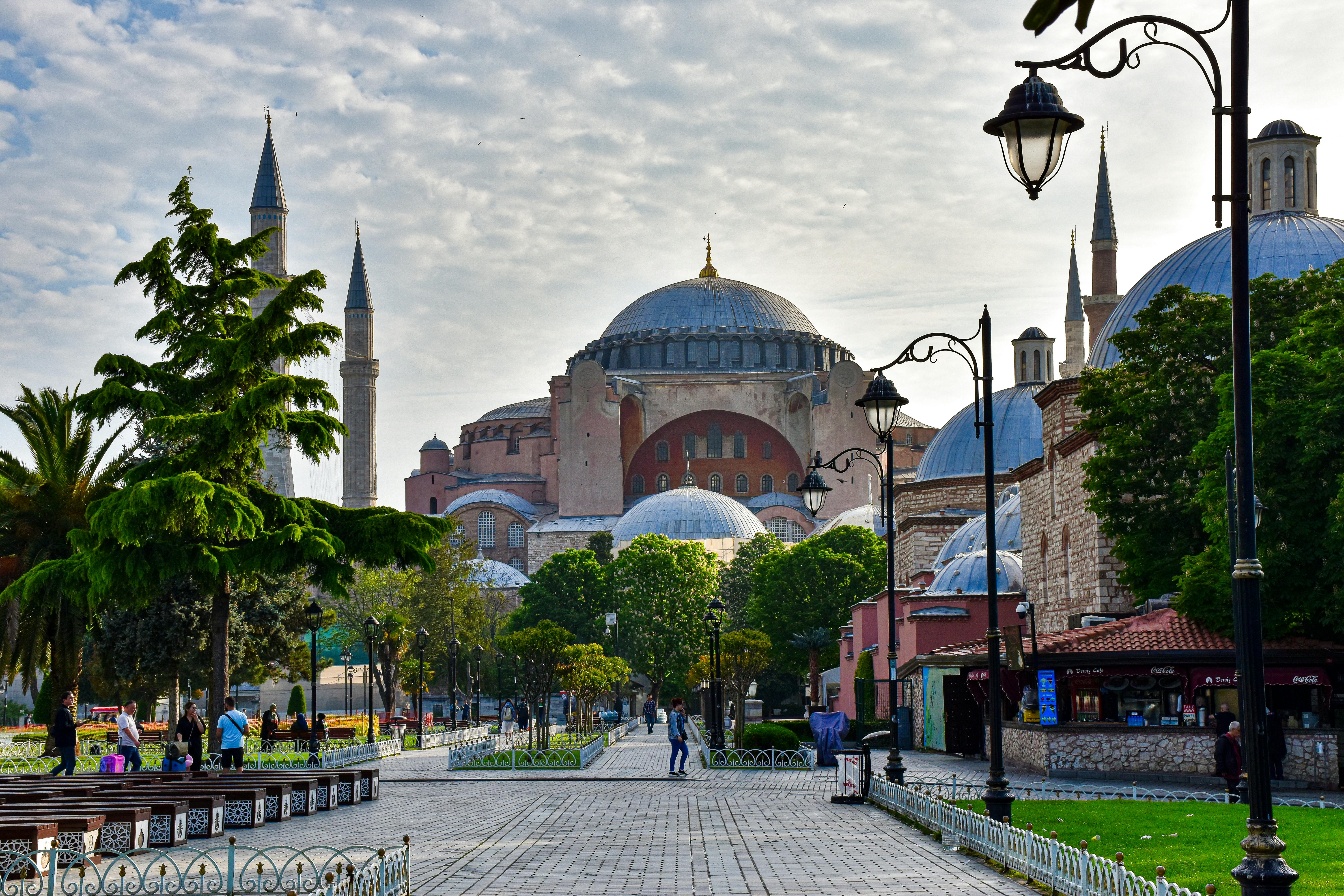 a city street with a mosque in the background