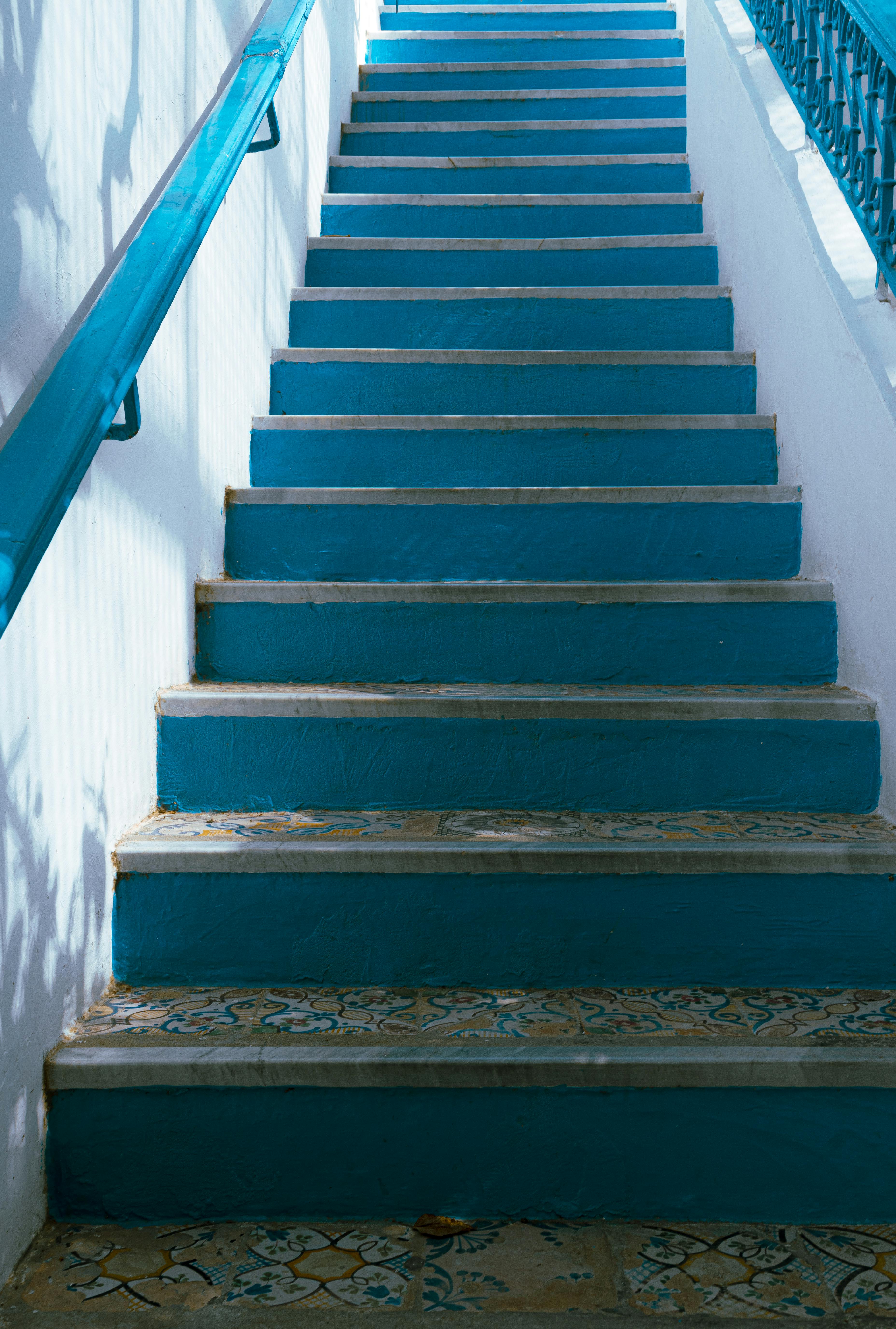 Blue-tiled staircase in Carthage, Tunisia, showcasing Mediterranean architecture.