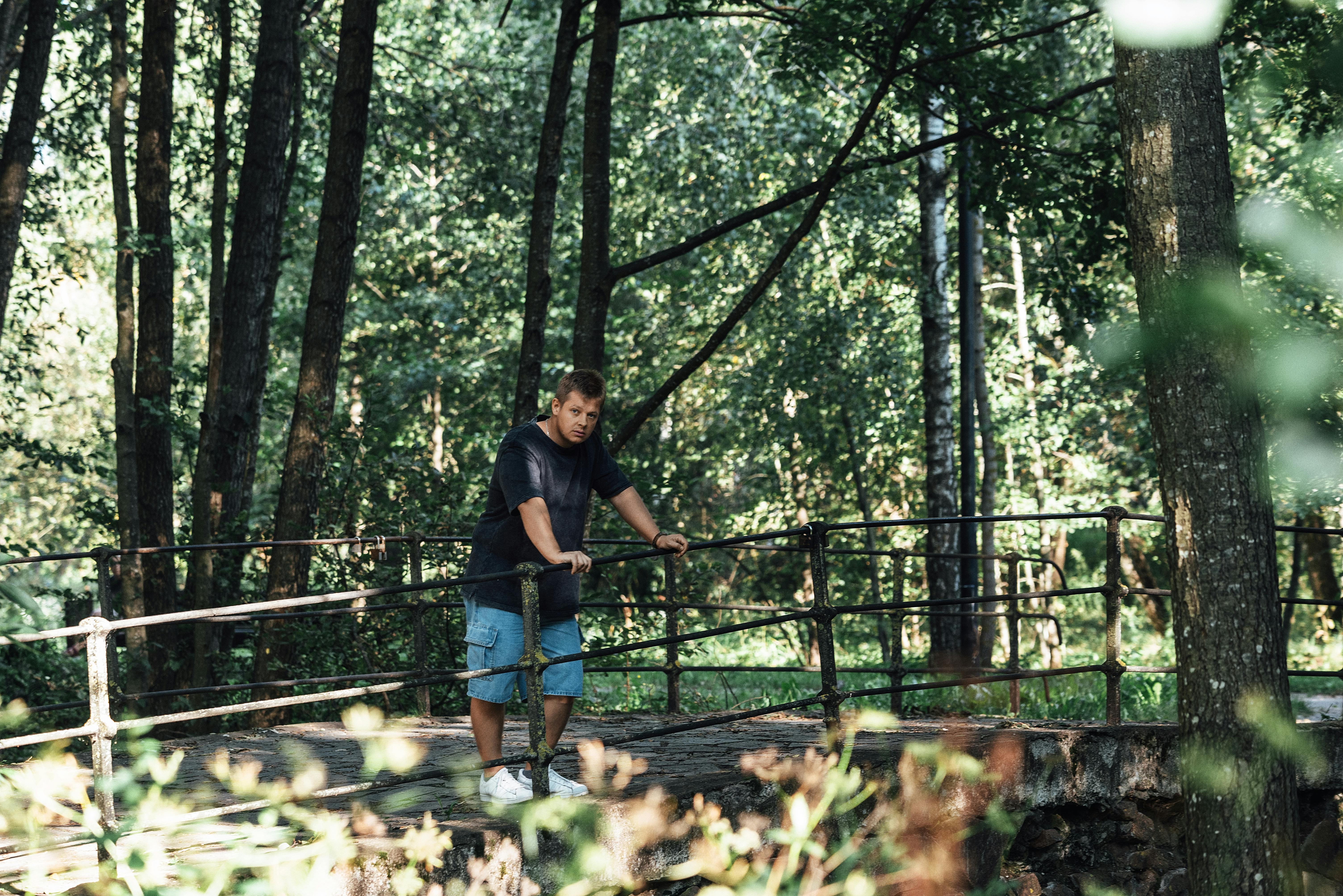 a man riding a skateboard on a bridge