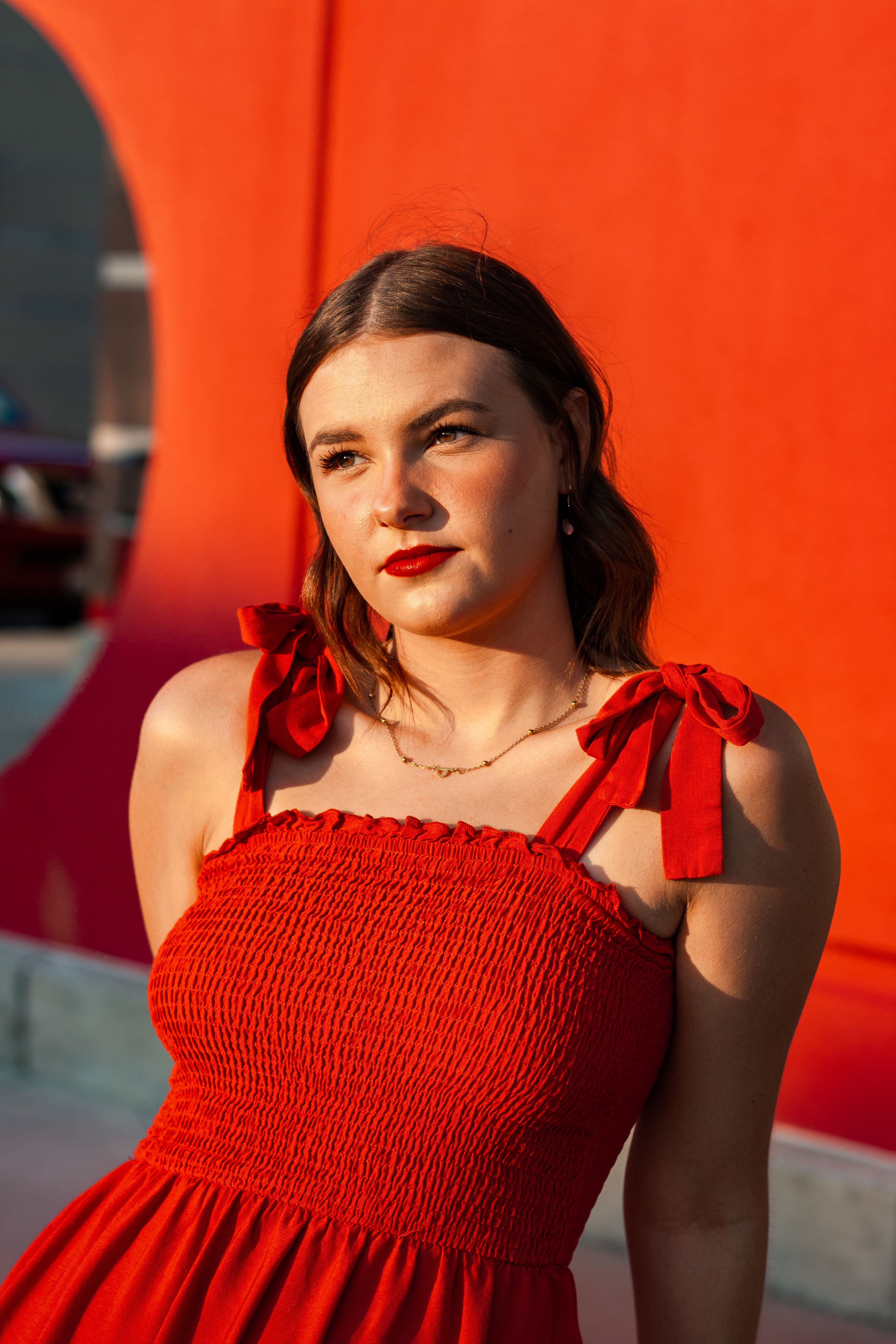 Stylish Portrait of Woman in Red Dress Outdoors · Free Stock Photo