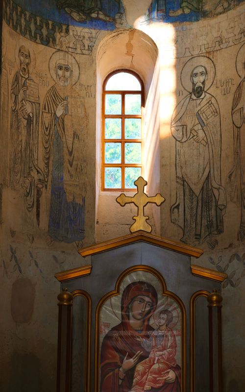 Free Interior view of church in Van, Türkiye, featuring religious icons and sunlight streaming through window. Stock Photo