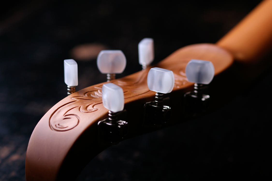 Free Close-up Photography of Brown String Instrument Headstock Stock Photo