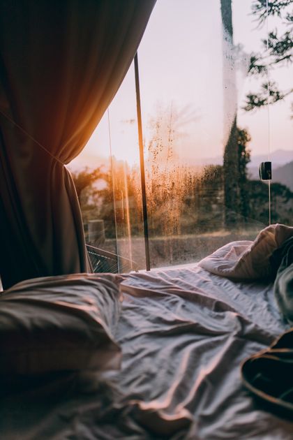 Morning light through a bedroom window — photo by Alexander Mass on Pexels