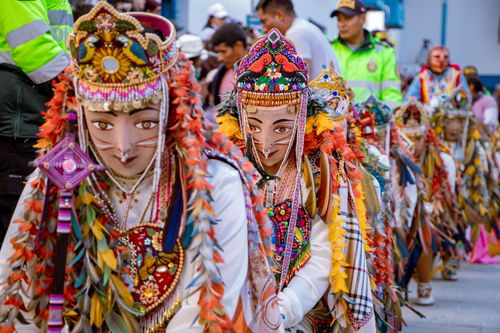 Free Colorful traditional dancers with masks celebrating in Paucartambo, Peru. Stock Photo