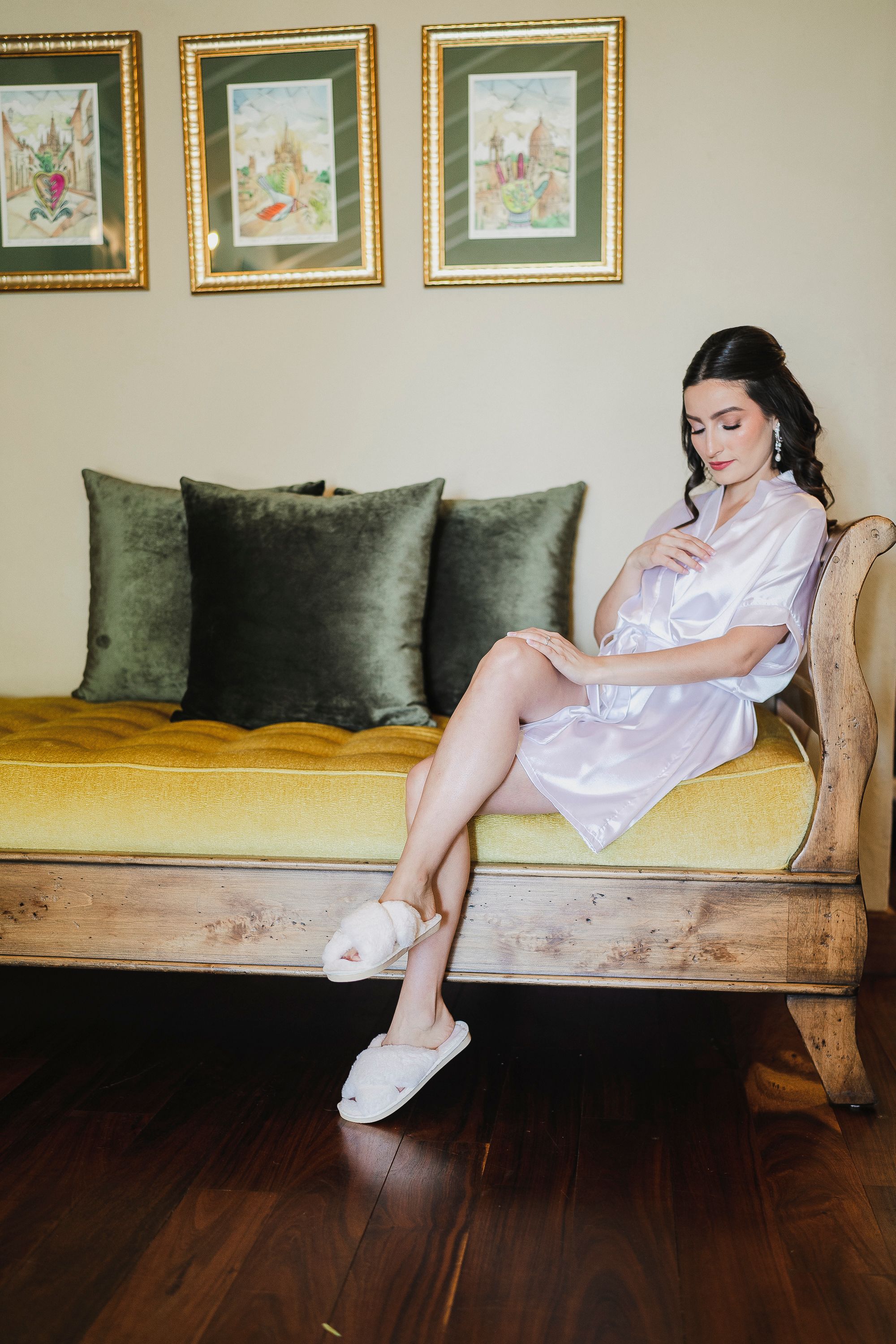 A woman in a white robe sitting on a couch · Free Stock Photo