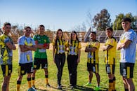 A group of soccer players posing for a photo