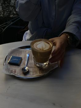A serene café setting featuring a latte with art, ideal for relaxing or working moments.