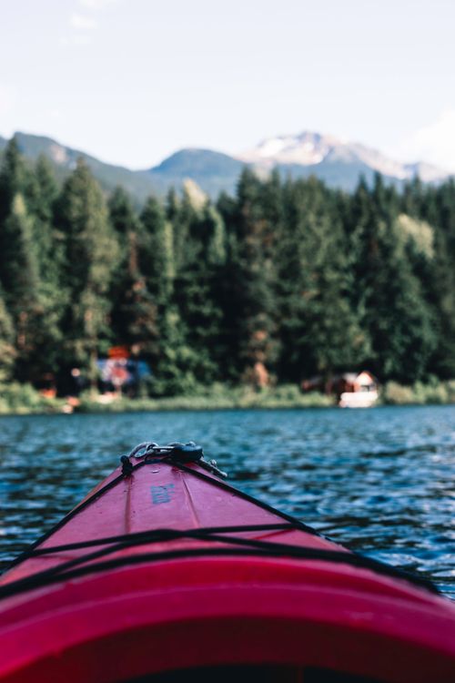 Free Explore the serene beauty of Whistler, BC with a kayak adventure on a crystal-clear mountain lake. Stock Photo