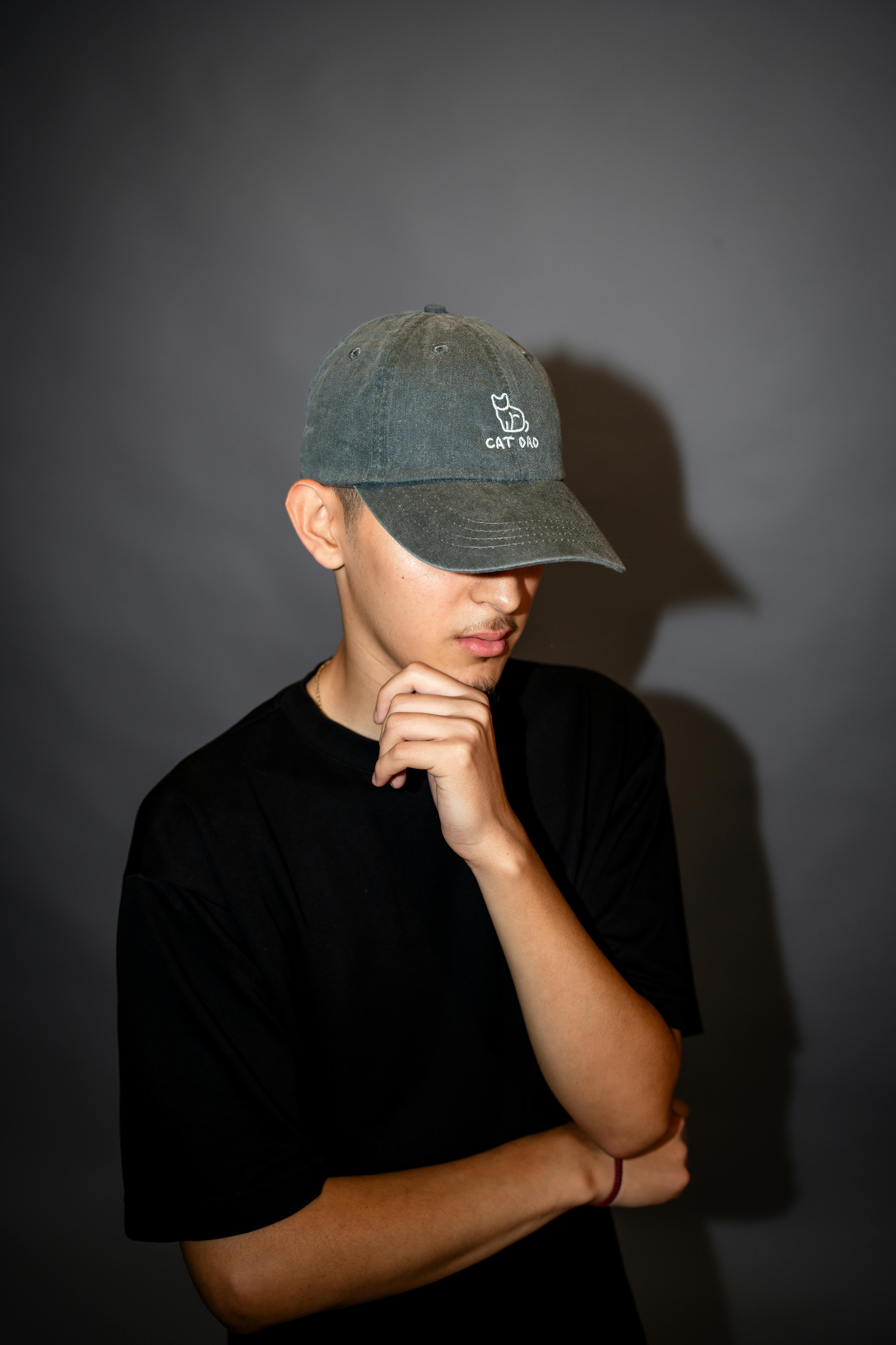 a young man wearing a baseball cap