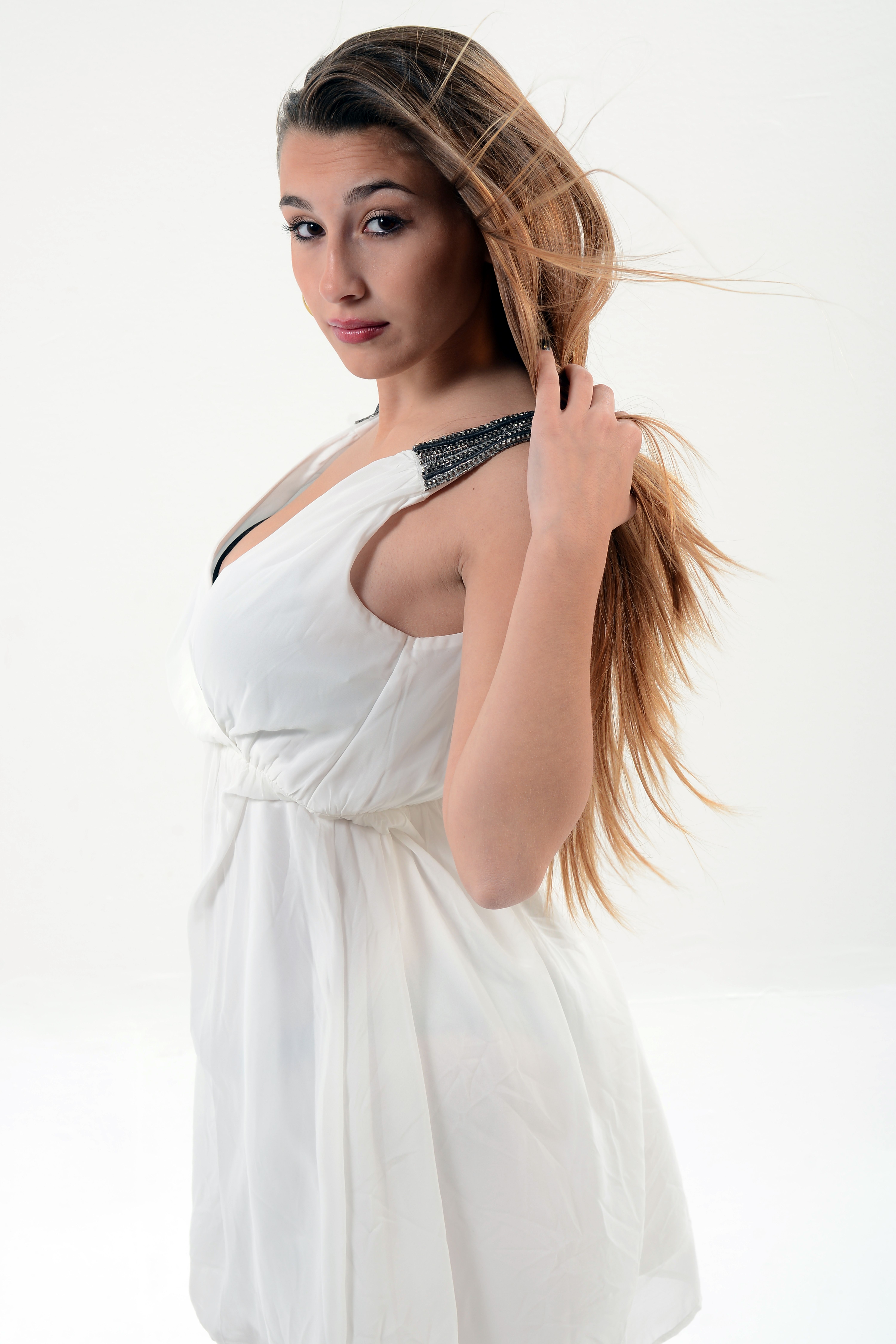 A woman in a white dress posing for a photo · Free Stock Photo