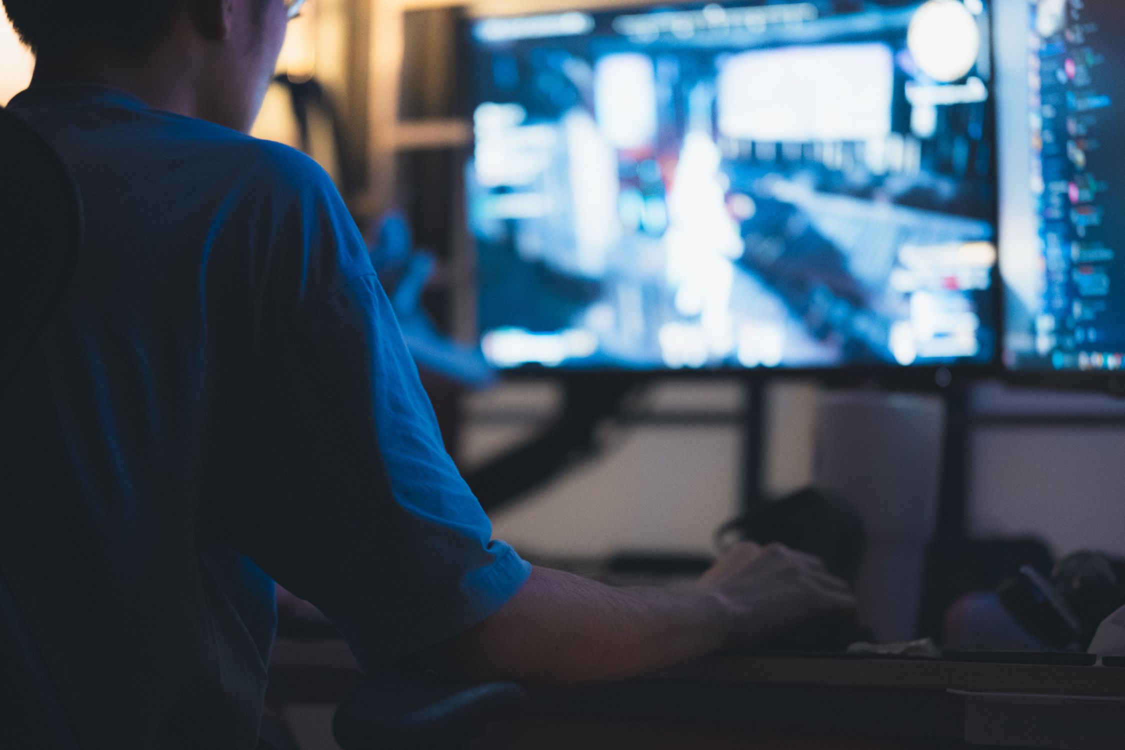 A person playing video games on a computer · Free Stock Photo