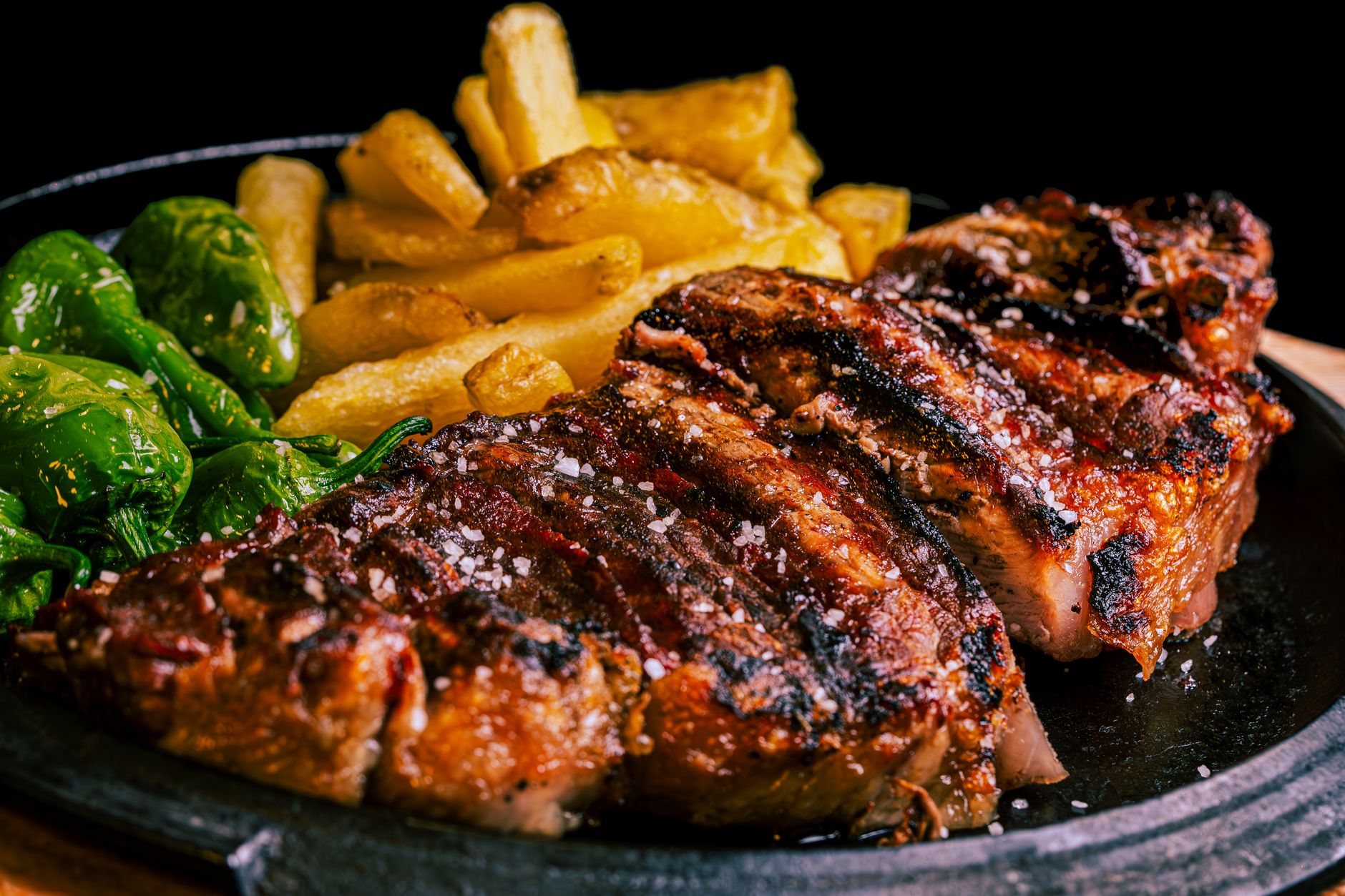 Sliced sirloin steak with poblano pesto