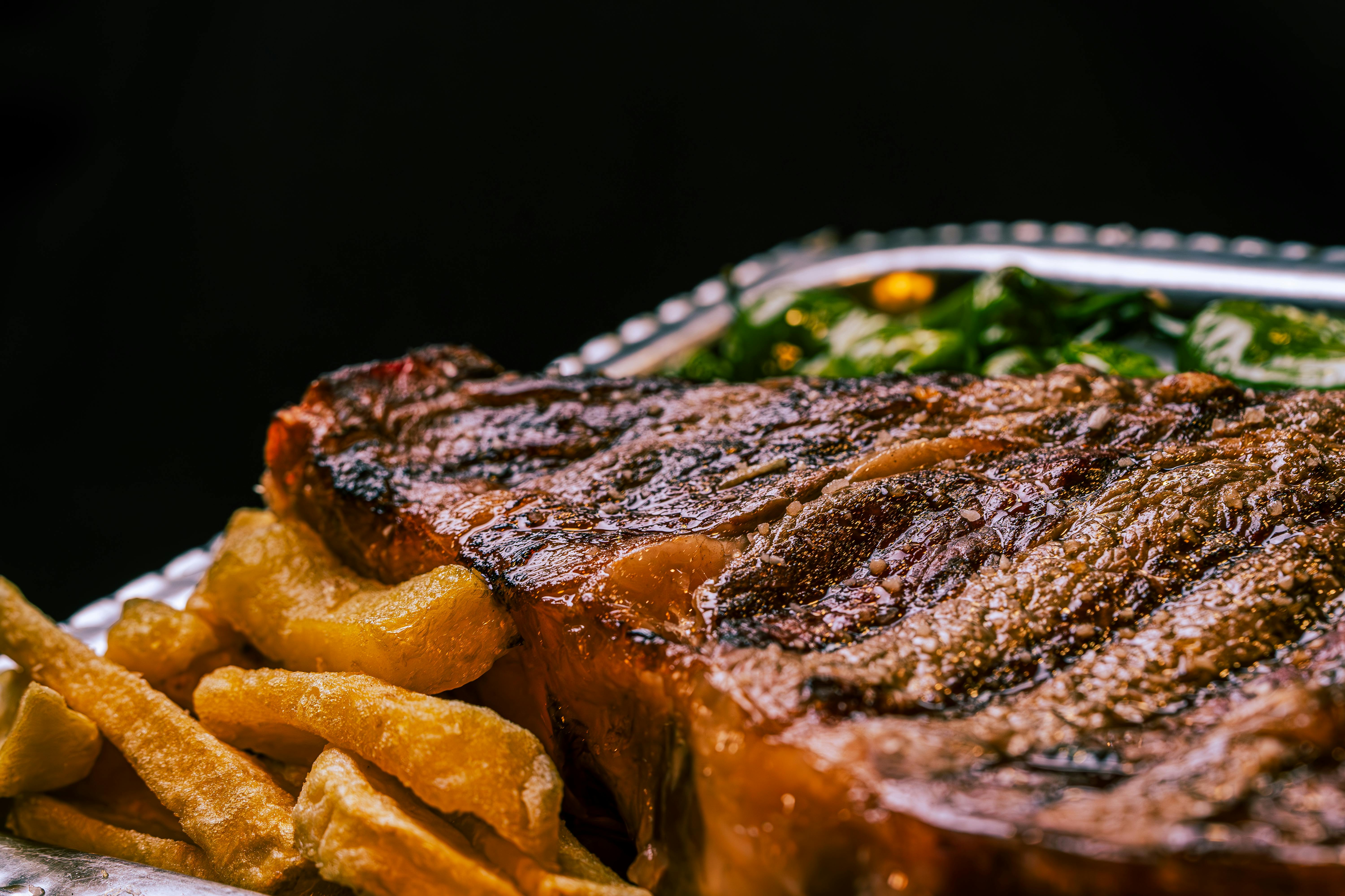 a steak and fries on a plate