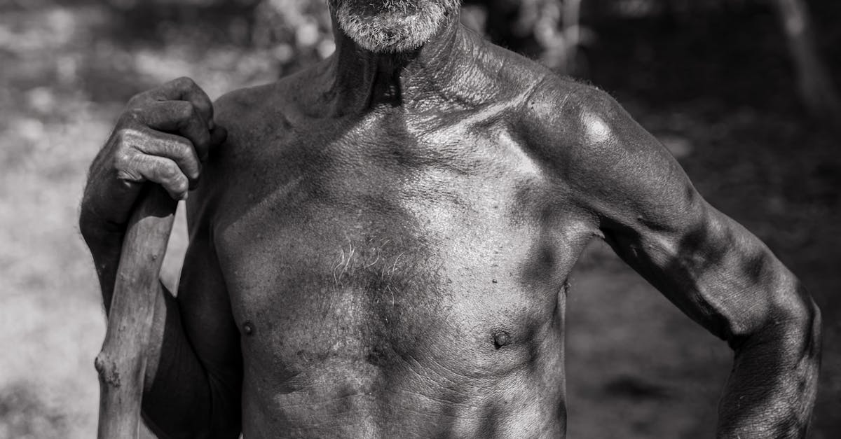 An old man with a hat and a stick