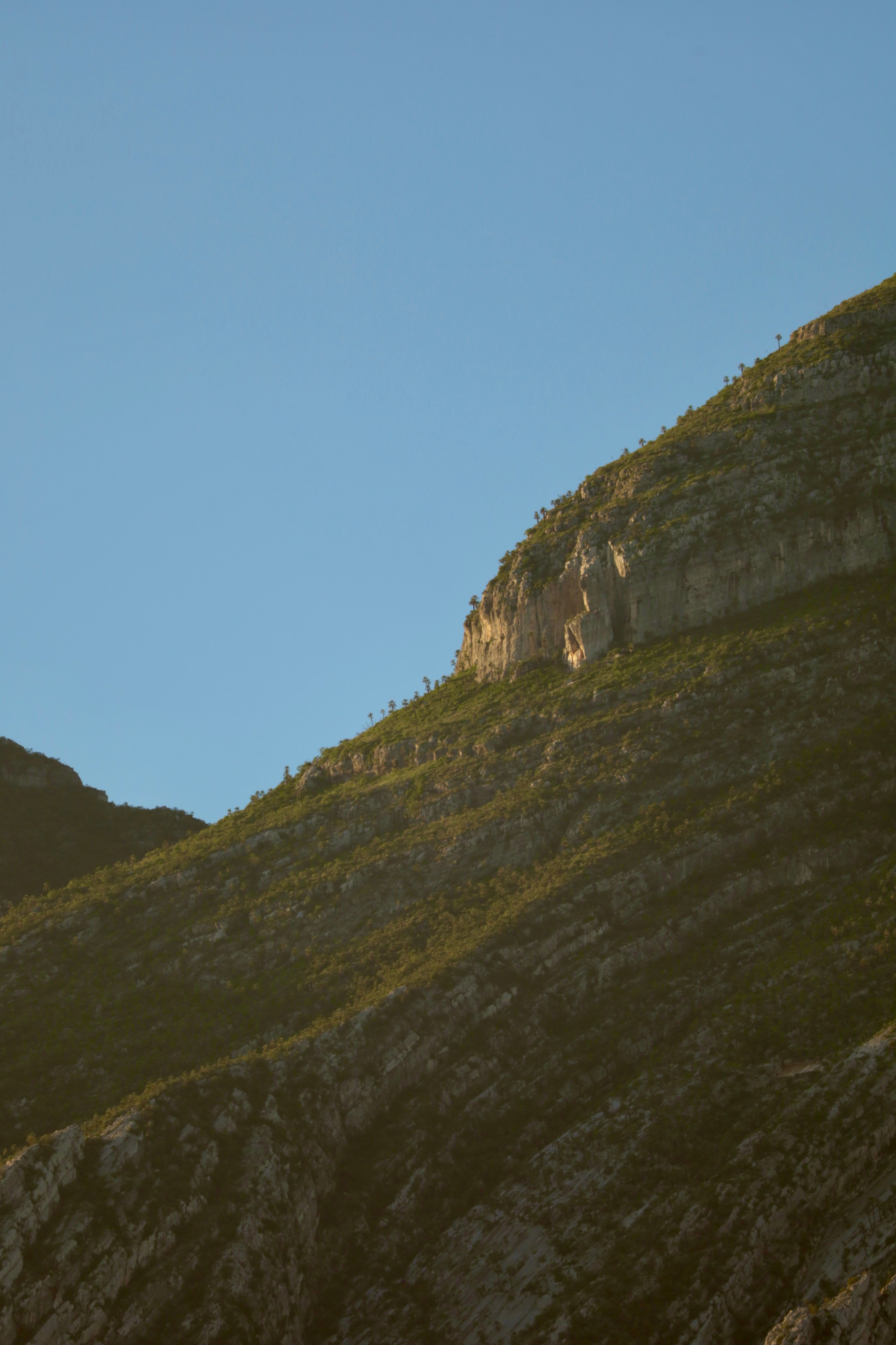 A mountain with a rock formation · Free Stock Photo