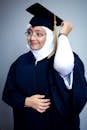 A woman in a graduation gown and cap