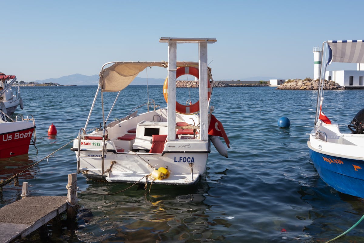 Group of people collaborating around laptops and mobile devices