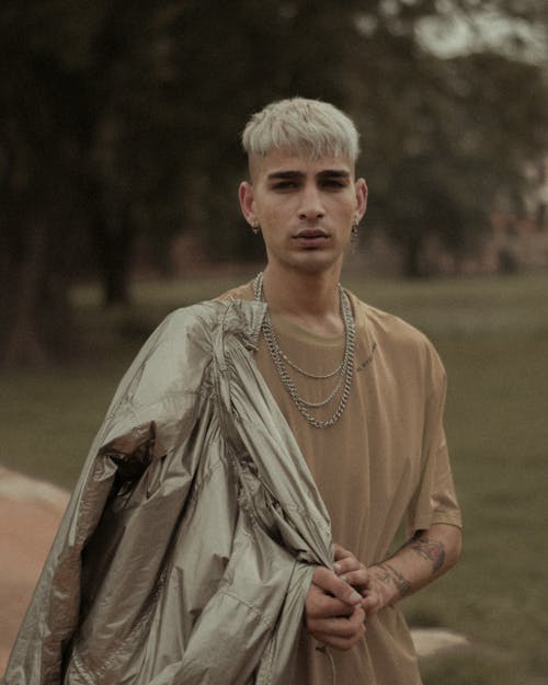 Photo of Man Wearing Brown Shirt