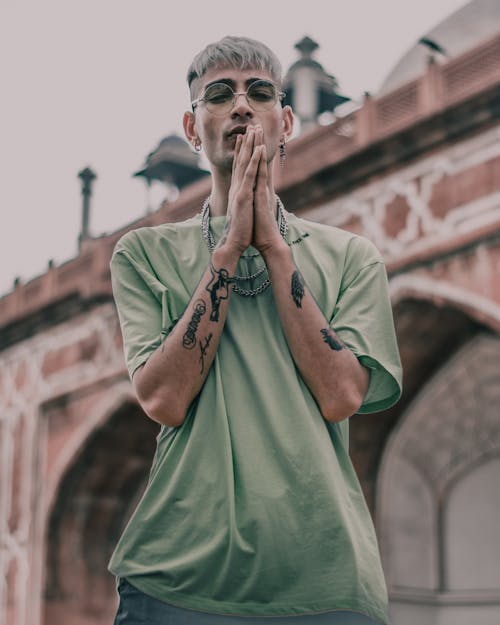 Photo of Man Wearing Green Shirt