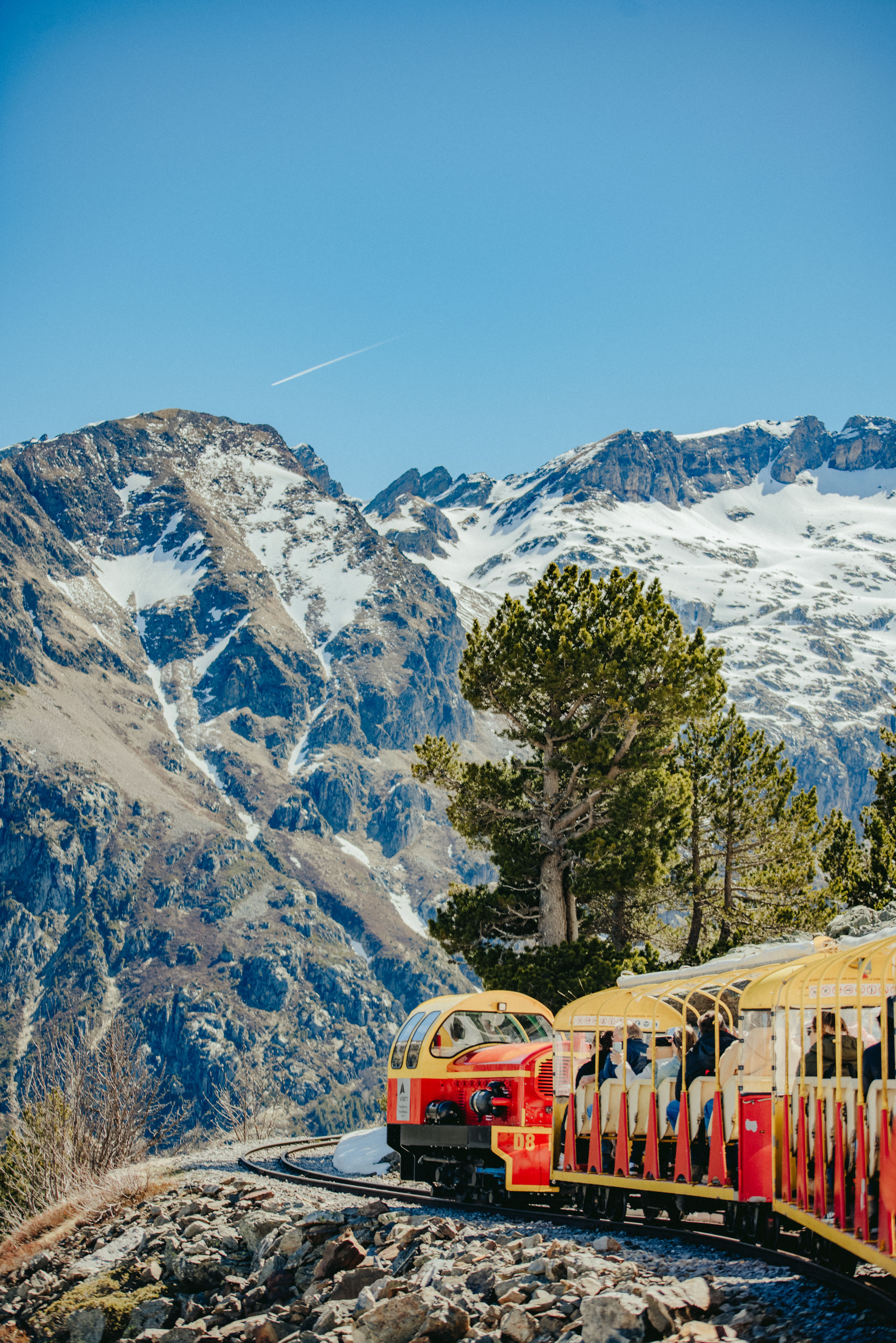 Experience breathtaking views of the Pyrenees on a historic train journey.
